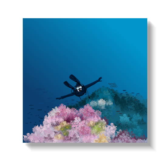 A diver floats with arms spread wide above a reef of pink, white and yellow coral, the deep blue water fading into darkness behind.