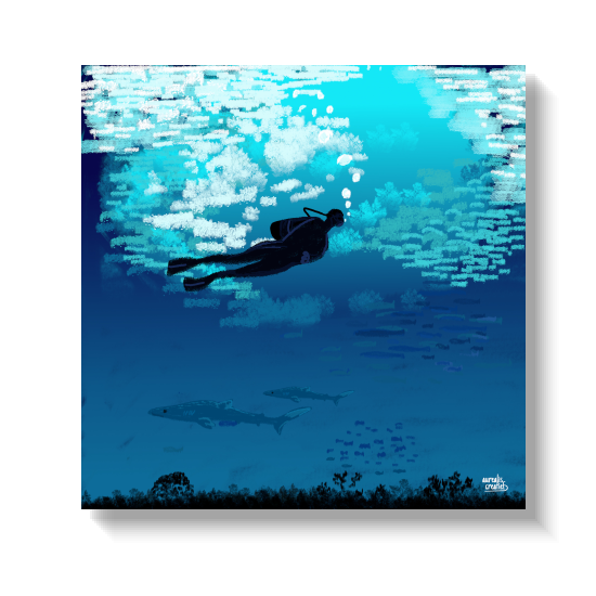 Diver among a shimmering shoal of fish, sharks cruising in the depths below.